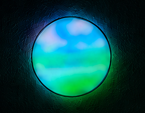 Round wall light washing the wall in blue and green