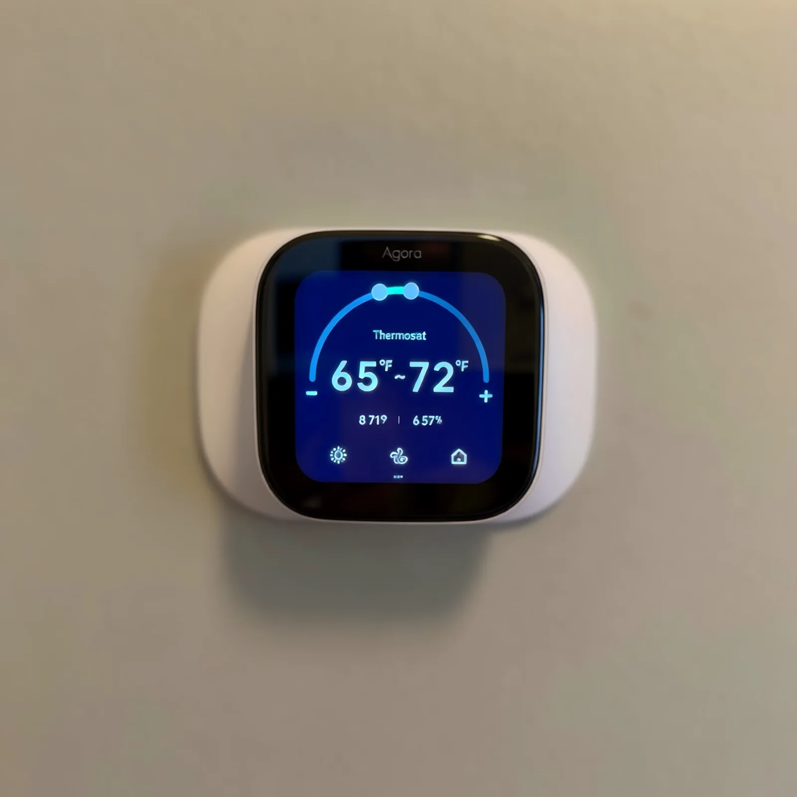Smart thermostat on a wall