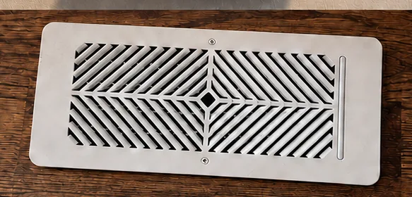 Smart air vent installed in a hardwood floor